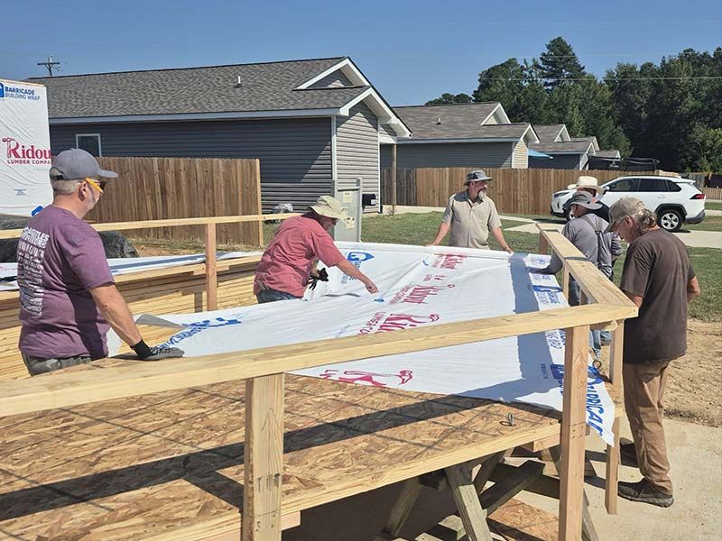 people volunteering at habitat for humanity saline county
